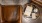 leather chairs and table top with books and a tea cup on saucer