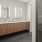 bathroom with dual sinks and mirrors