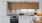 a kitchen with white cabinets