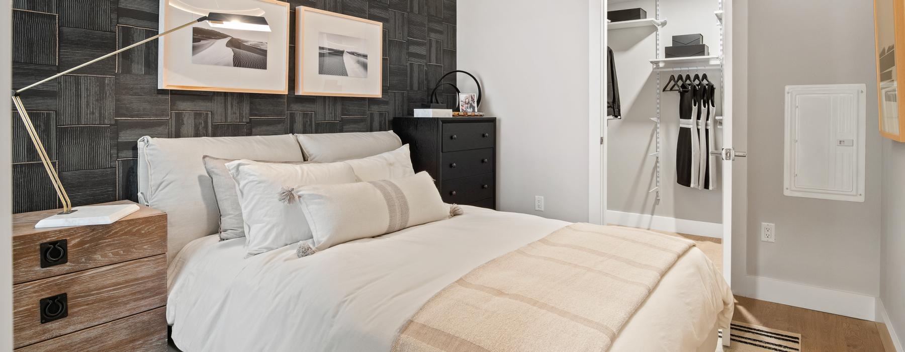 a bedroom with a bed and a lamp