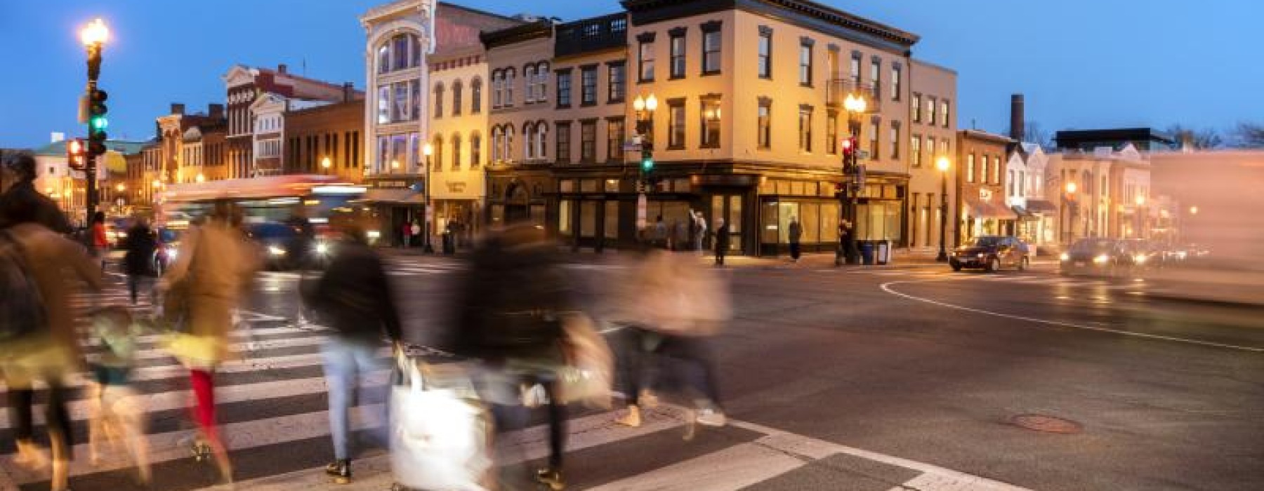 a group of people crossing a street