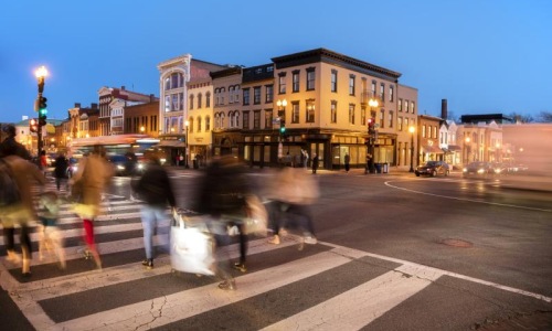 a group of people crossing a street
